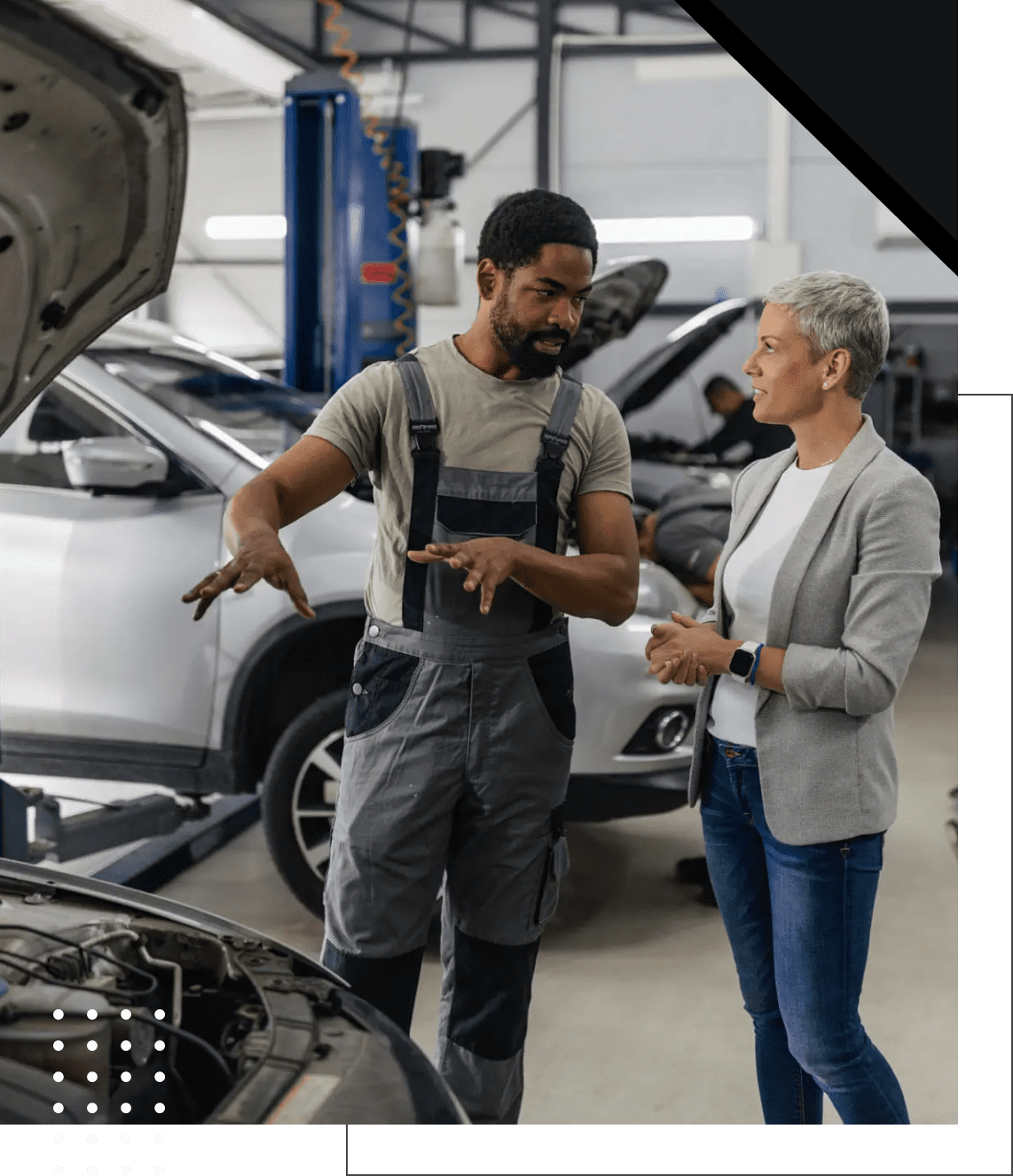 Car repair discussion in workshop