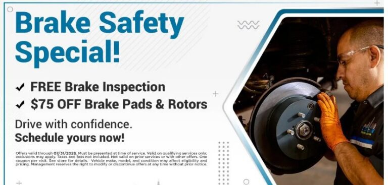 Mechanic inspecting car brake with promotion banner